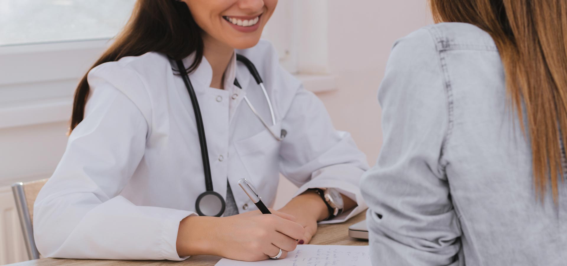 Dr Linda Raeisi consulting with a patient